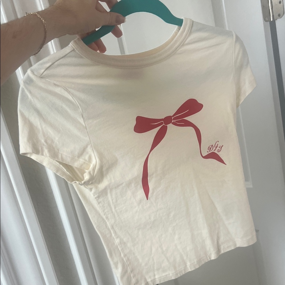 Dairy Boy Cream T-Shirt with Red Bow Design